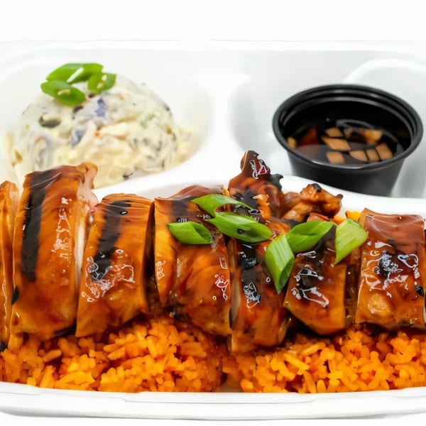 Legends Pacific Island Grill's teriyaki chicken with orange rice, potato salad, and dipping sauce.